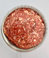 Load image into Gallery viewer, Carolina Wild raw cat food in metal bowl against white background. Visible in bowl a mixture of raw chicken, ground bone, liver, heart, gizzards, eggs, taurine