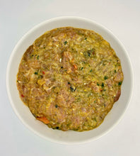 Load image into Gallery viewer, Carolina Wild raw dog food in white bowl against a white background. Visible in bowl a mixture of turkey, fruit, vegetables.