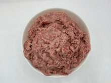 Load image into Gallery viewer, Raw beef pancreas in a white dog food bowl; against a white background.