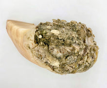 Load image into Gallery viewer, Cow hoof dog chew stuffed with raw green tripe, shown against white background