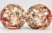Load image into Gallery viewer, Two halves of Xkaliber for dogs, a blend of raw: green tripe, beef heart, tongue, trachea, & ground bone. Against white background.