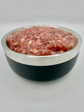 Load image into Gallery viewer, Carolina Wild raw cat food in black and silver bowl against white background. Visible in bowl a mixture of raw chicken, ground bone, liver, heart,  gizzards, eggs, taurine
